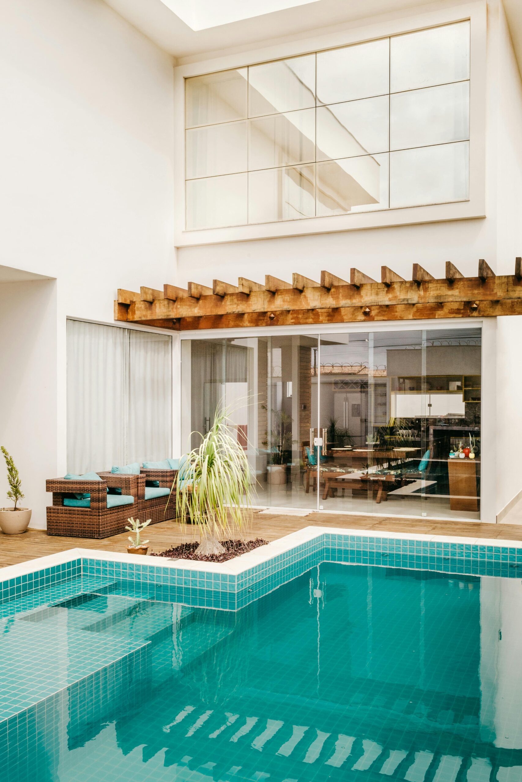 Stylish modern villa featuring an outdoor pool and cozy patio area.